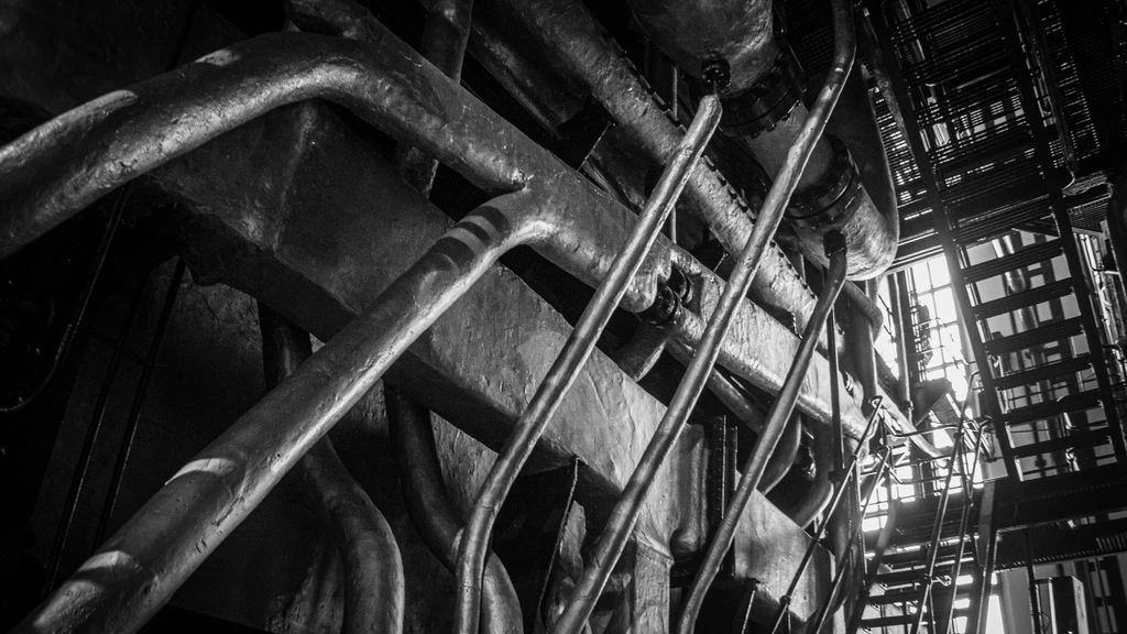 Welder TIG-welding a header tube on the Canton shop floor